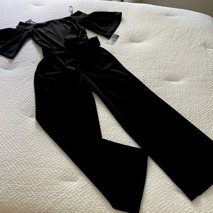 Beautiful elegant jumpsuit, black, brand new with tags! Size 0.regular length